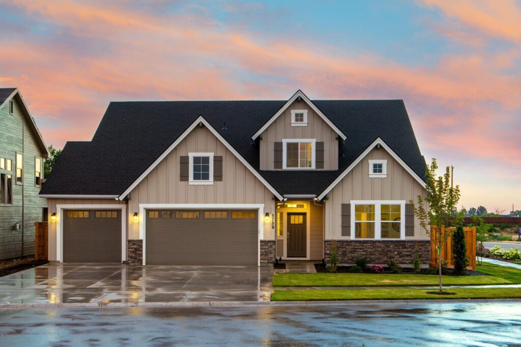 Single family home with manicured lawn and front porch